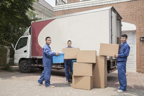 Professional movers planning a home move in Holland Park
