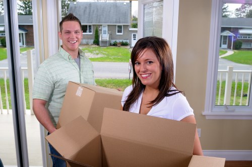 Professional movers assisting with a property move in Holland Park