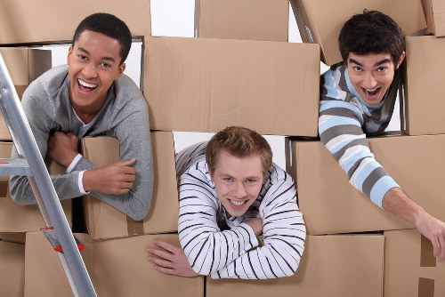 Furniture removals team handling a move in Holland Park with care