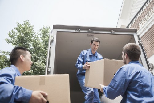 Careful loading of boxes and furniture for a Holland Park removal