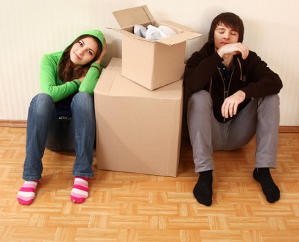 Packed boxes and furniture ready for a house move in Holland Park