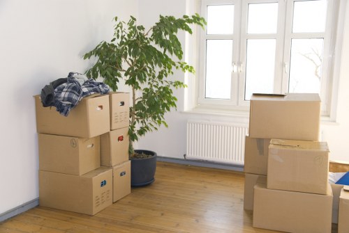 Furniture and household items being transported by a local Holland Park van service
