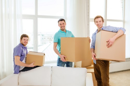 Loading furniture into a moving truck for a Holland Park move