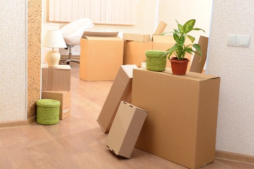 Preparing boxes and furniture for a moving truck booking in Holland Park
