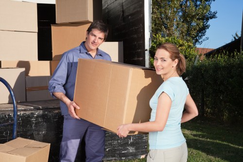 Boxes and furniture prepared for a residential move in a Holland Park flat or townhouse