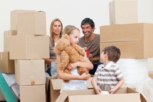 Careful loading of student furniture and boxes for a move in West London