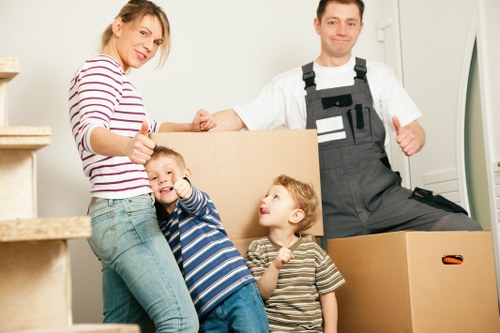 Local moving van loading household furniture in West London