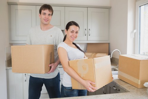 Professional man and van handling furniture transport in Holland Park