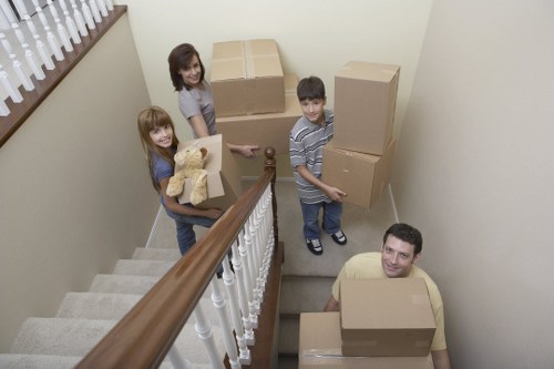 Professional movers handling boxes and furniture for a same day job